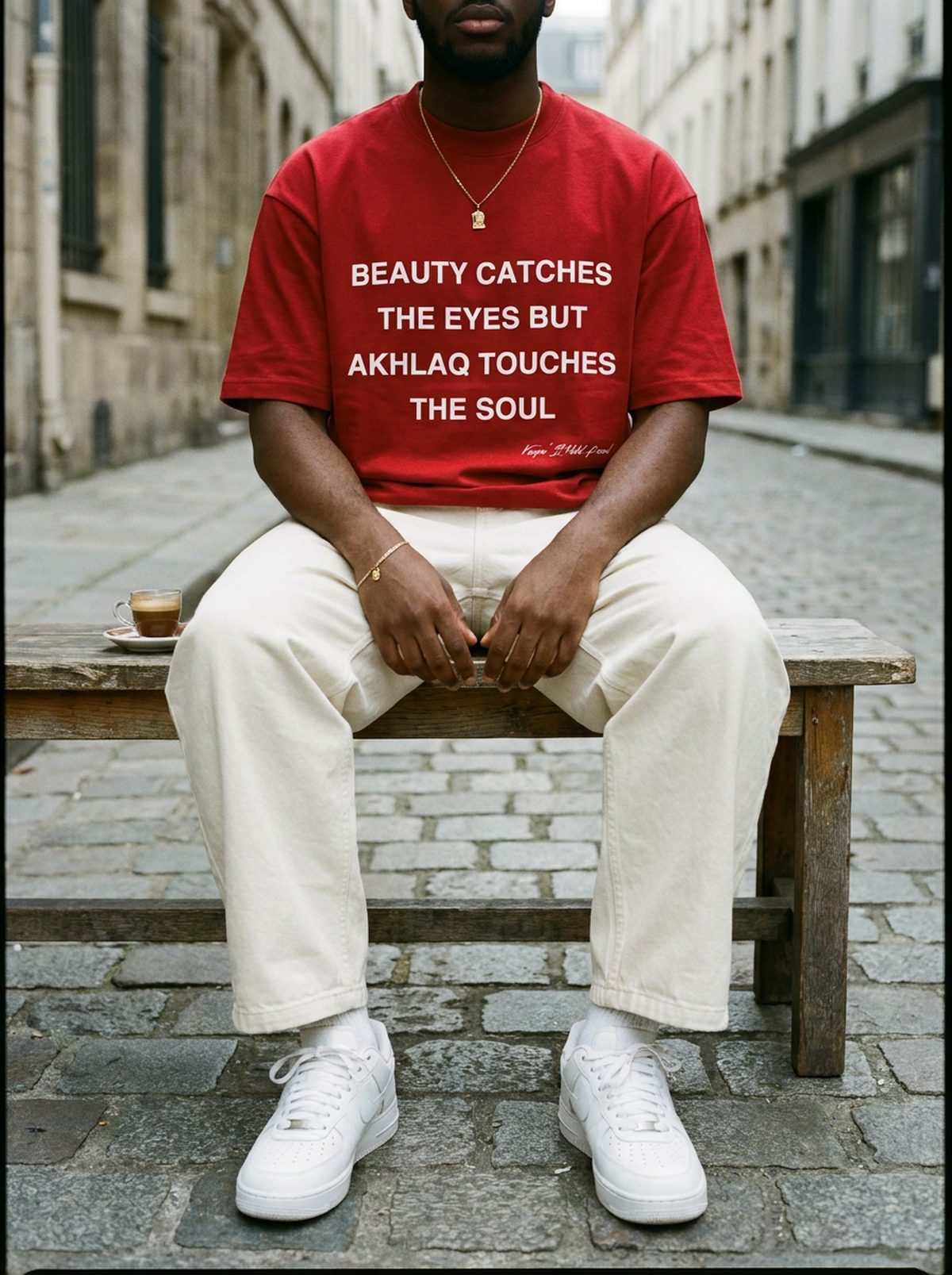 Akhlaq Over Beauty red heavy tee, cafe bench