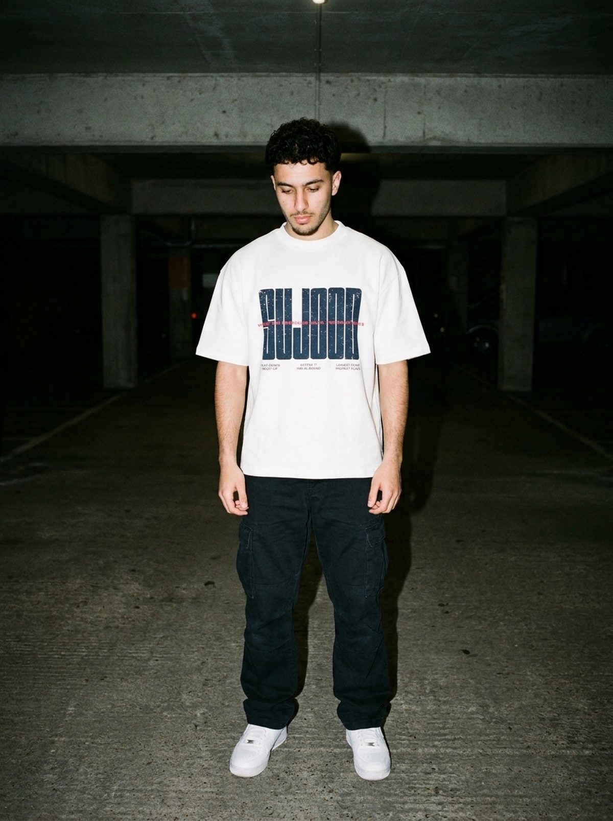 Sujood for the Heart white tee, garage flash