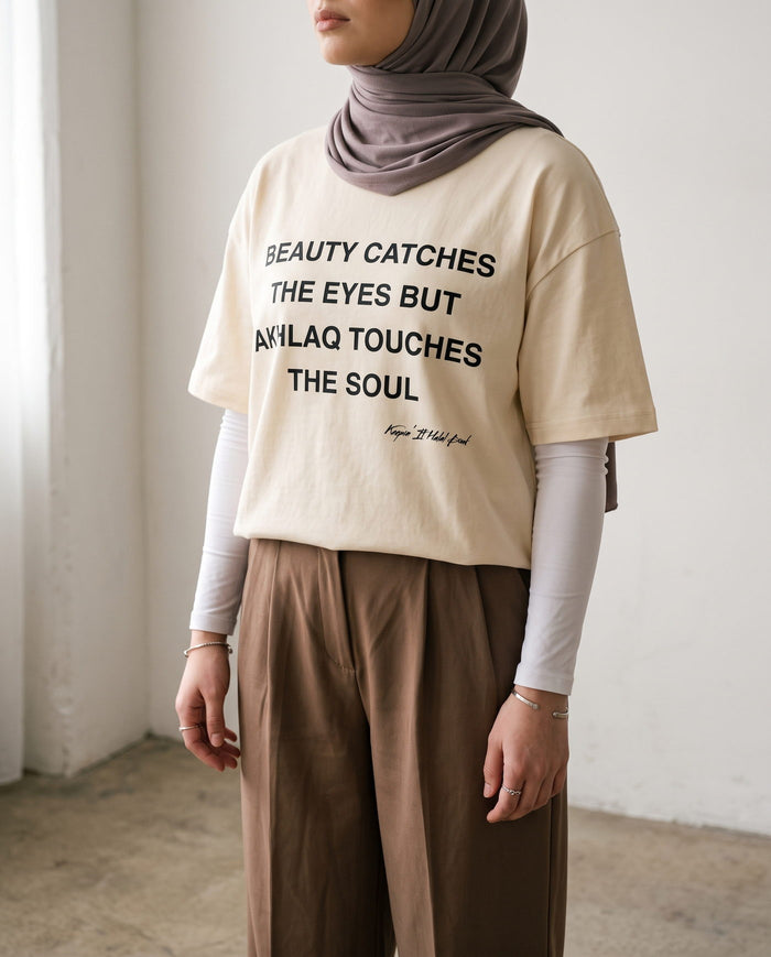 Akhlaq Over Beauty natural boxy tee front print in close detail