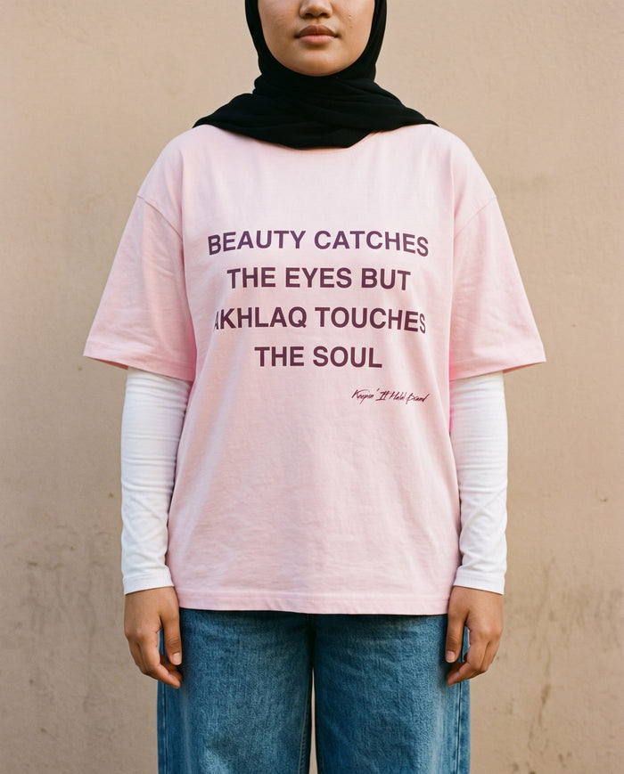 Akhlaq Over Beauty soft pink boxy tee front print in close detail