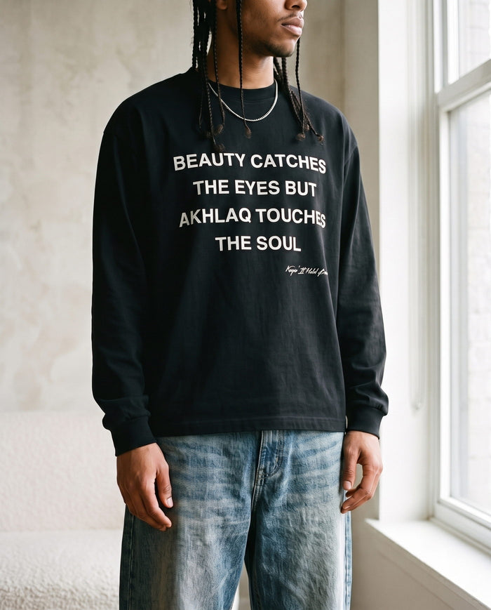 Akhlaq Over Beauty black long sleeve front print in close detail