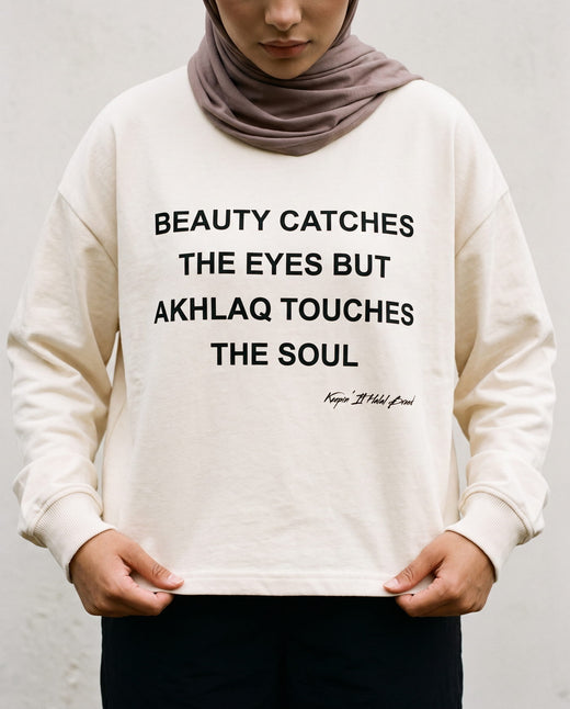 Akhlaq Over Beauty bone long sleeve front print in close detail