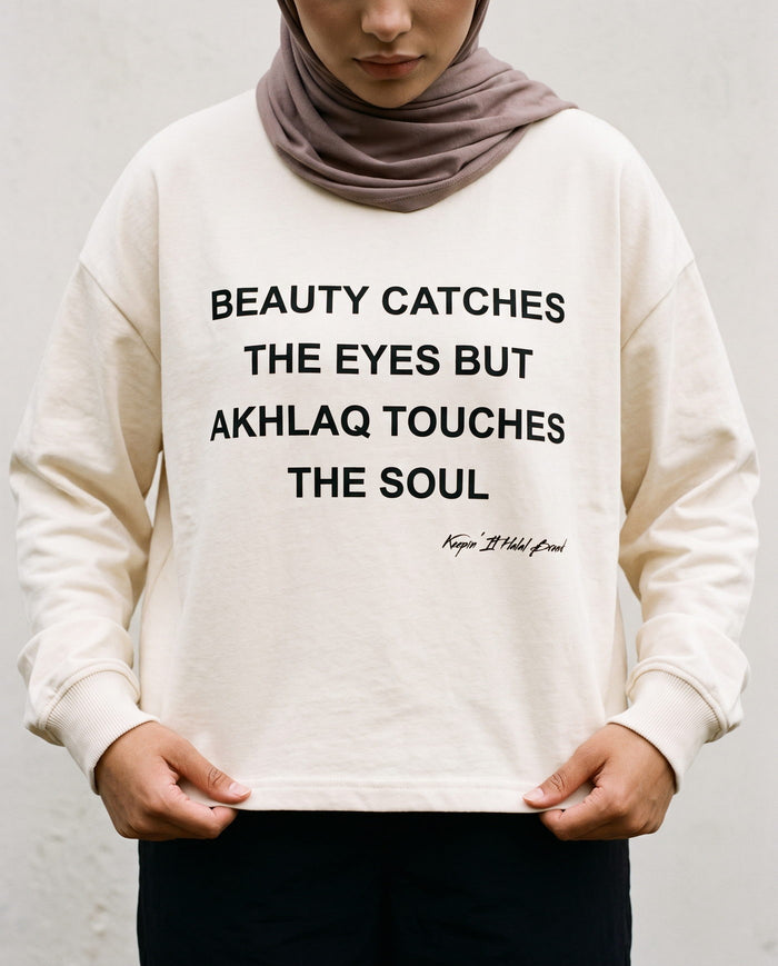 Akhlaq Over Beauty bone long sleeve front print in close detail