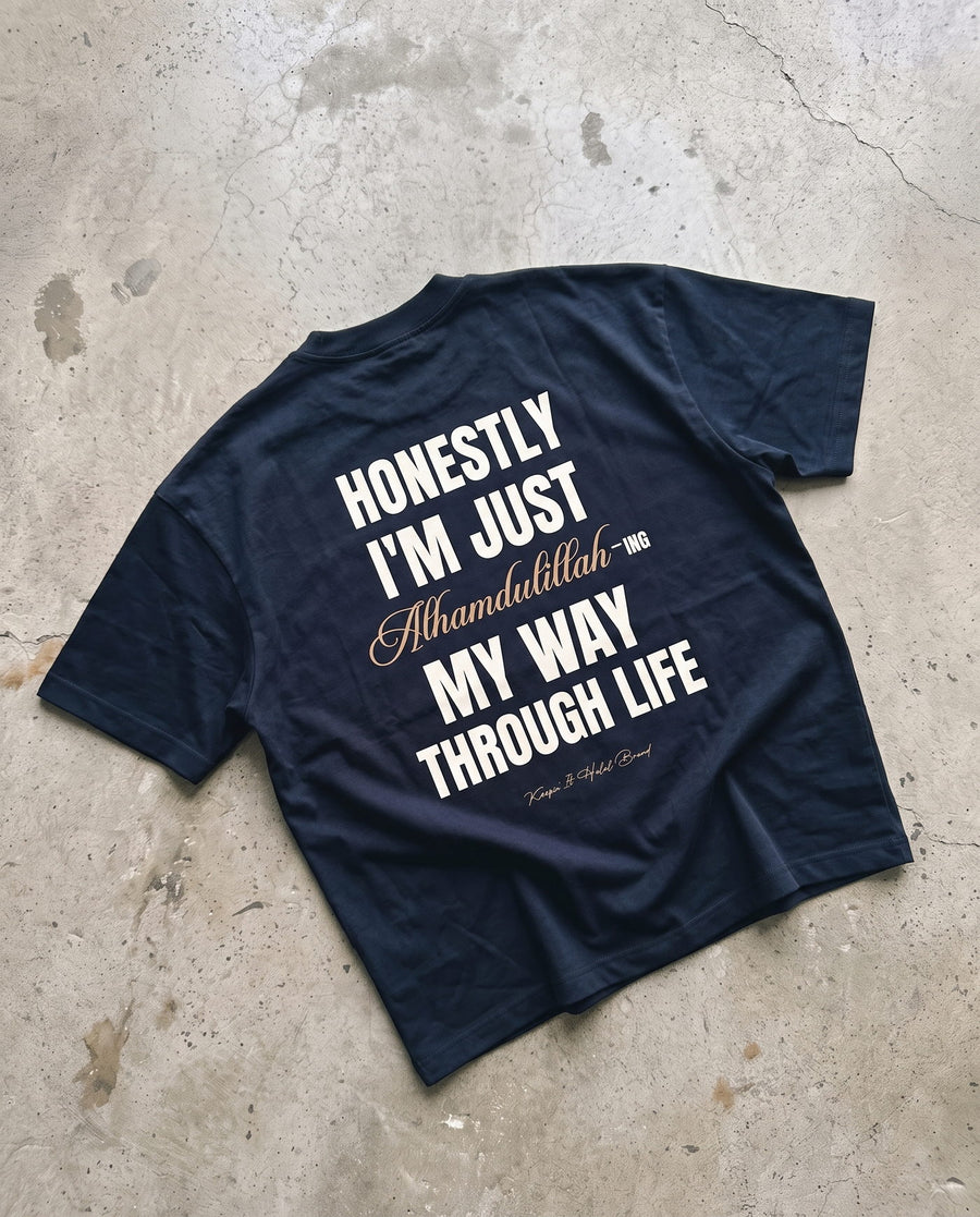 Honestly, Alhamdulillah navy boxy tee laid back-side-up on concrete