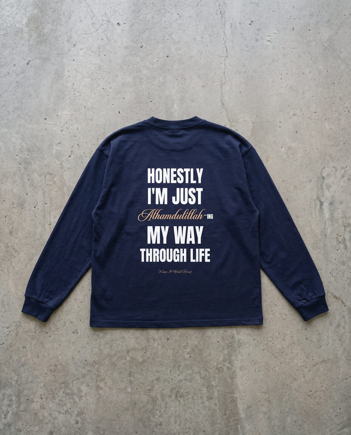 Honestly, Alhamdulillah vintage navy long sleeve laid back-side-up on concrete