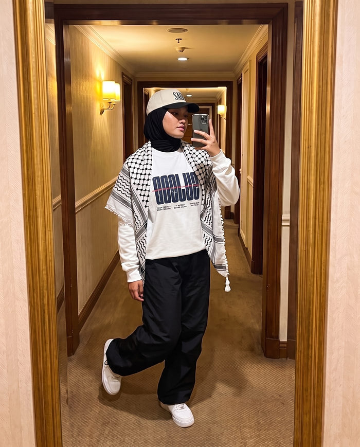 Sujood for the Heart white long sleeve in a hotel-corridor mirror selfie