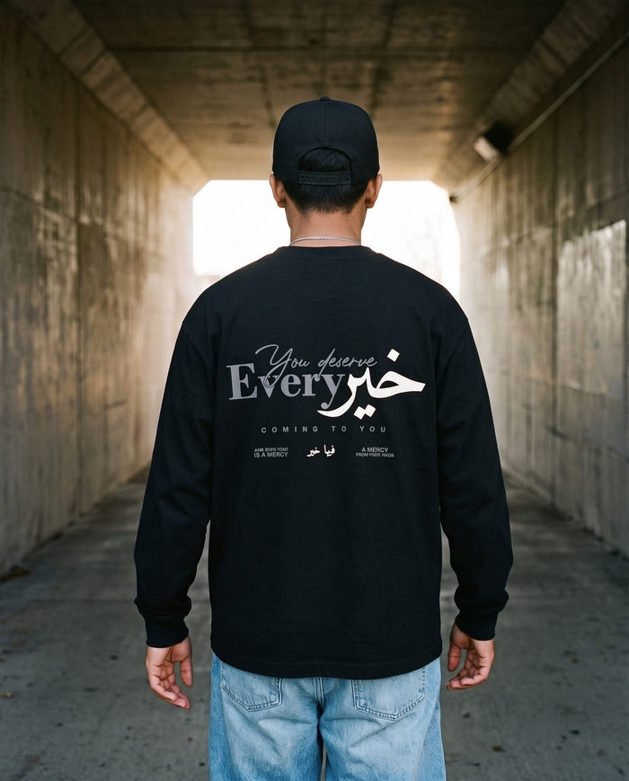 You Deserve Every Khayr black long sleeve back print in a rail underpass