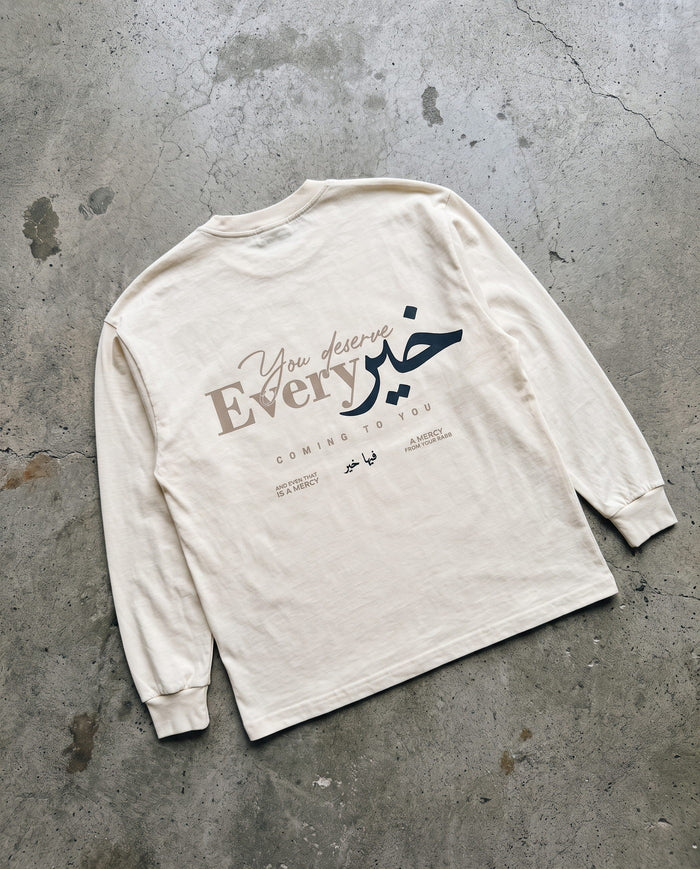 You Deserve Every Khayr bone long sleeve laid back-side-up on concrete