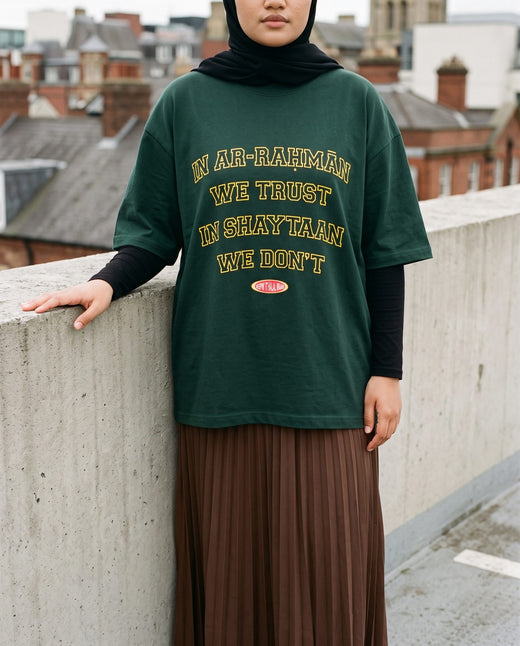In Ar-Rahman We Trust forest boxy tee on a car park deck