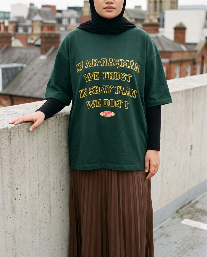 In Ar-Rahman We Trust forest boxy tee on a car park deck