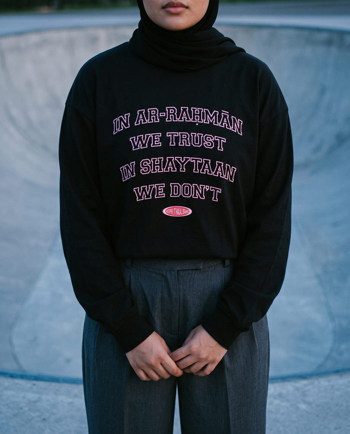 In Ar-Rahman We Trust black long sleeve at a skatepark at blue dusk