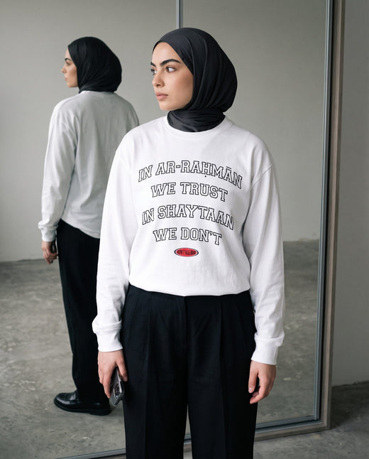 In Ar-Rahman We Trust white long sleeve in a full-length mirror