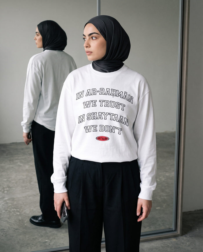 In Ar-Rahman We Trust white long sleeve in a full-length mirror