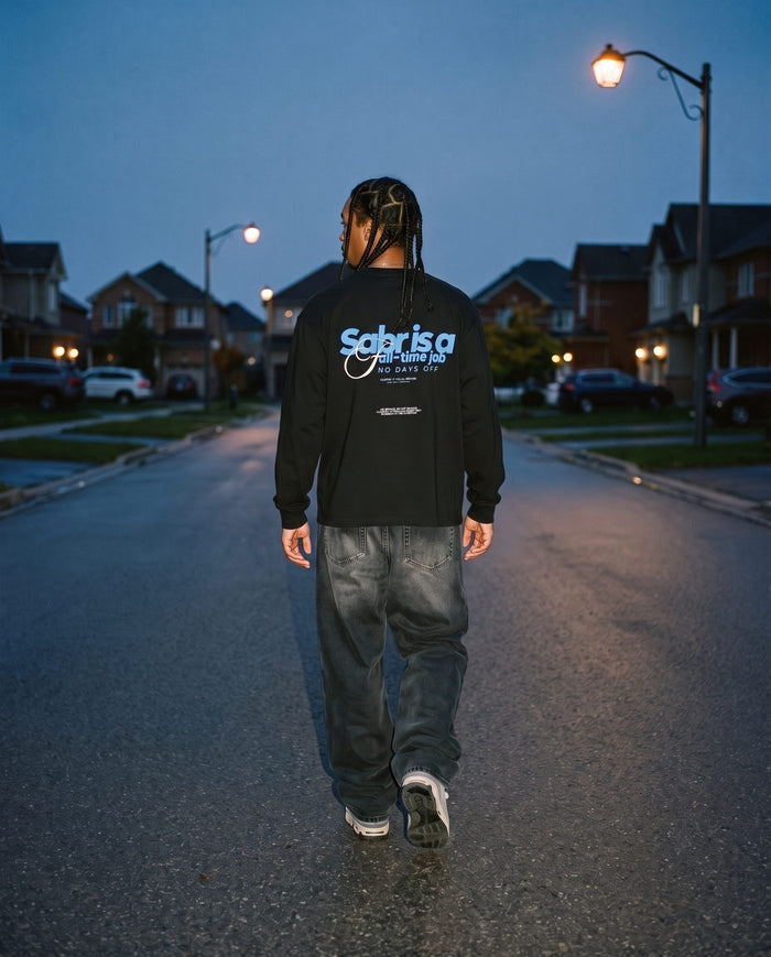 Full-Time Sabr black long sleeve back print, walking away at blue hour